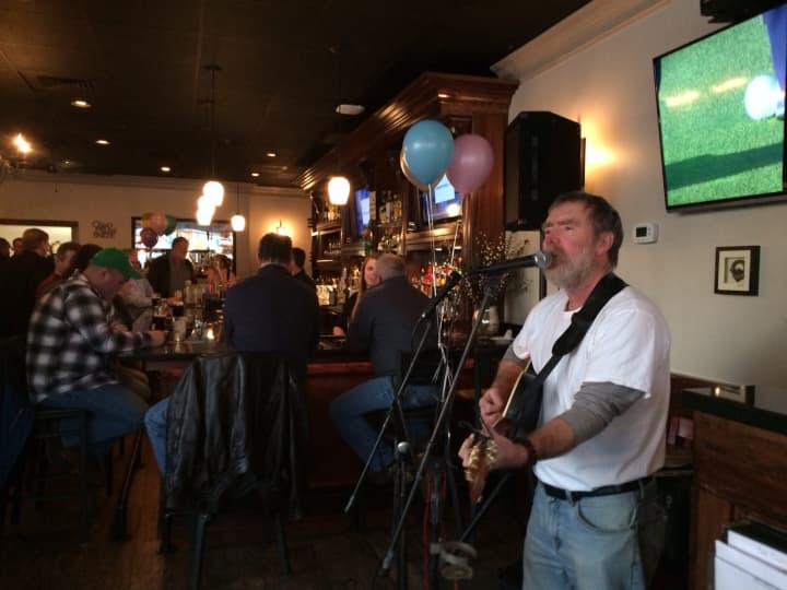Con O&#x27;Halloran serenades the crowd at the grand opening of The Castle on Post in Fairfield.
