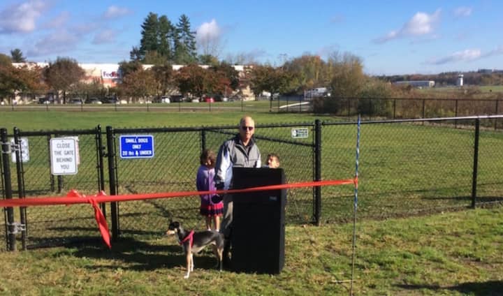 Jacob Saadi, 8, thanks Danbuy&#x27;s mayor for building the dog park, and introduces his sister, Sabrina to the crowd assembled for the dog park&#x27;s ribbon cutting on Monday. Danbury Mayor Mark Boughton looks on with his dog, Ellie.