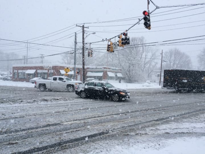Traffic moving at the corner of the Post Road and North Benson Road in Fairfield.