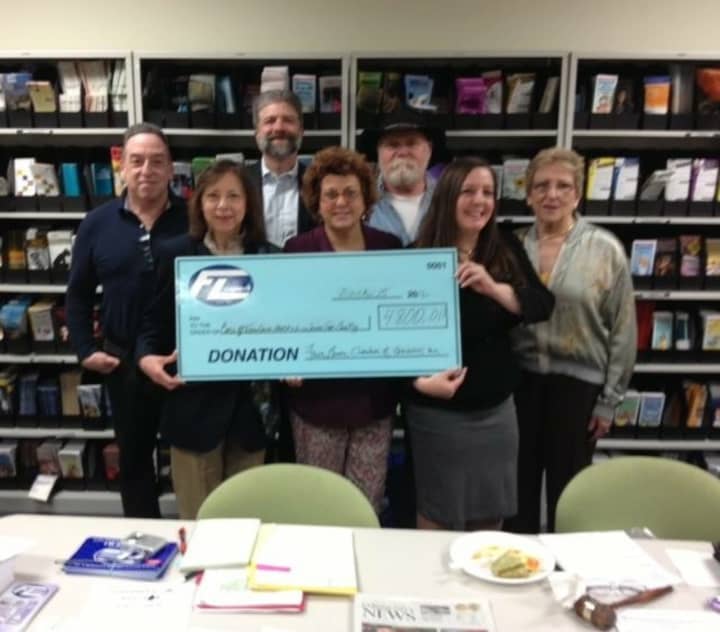 The Executive Board of the Chamber handed a $4,800 check to Carol Wagner, of the borough Health Department and Liz Twizzs of the Food Pantry.