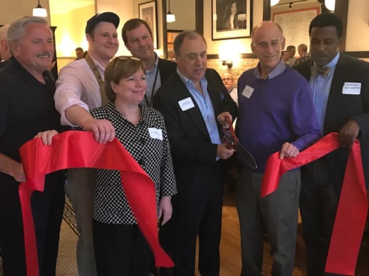 A ribbon-cutting ceremony on Thursday evening at The Rex, a new lobster and pizza restaurant at 247 North Central Ave. (Route 100) in Hartsdale. Front row, from left, are Bridget Gibbons, Rex owner Jonathan Otto and Greenburgh Supervisor Paul Feiner.