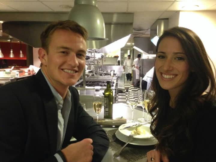 Ryan Brining and his fiancee, Emily Battersby, enjoy a meal together.
