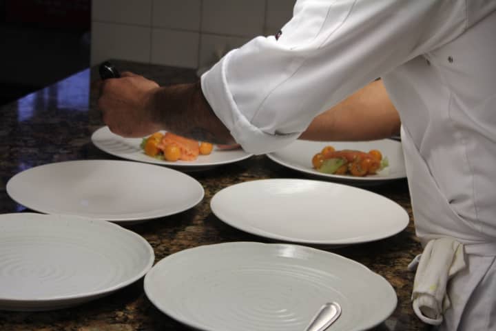 Plating food at Equus Restaurant, which has Thanksgiving specials.