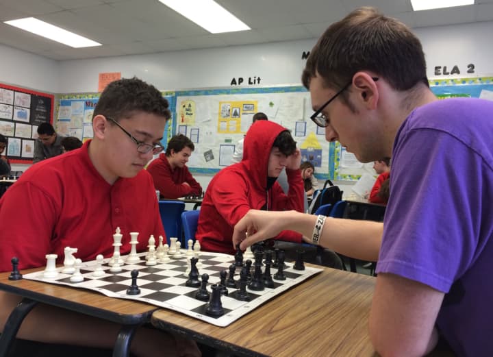 Elmwood Park freshman James Piereschi, at left, and senior Matt Tester play chess at the high school&#x27;s club meeting.