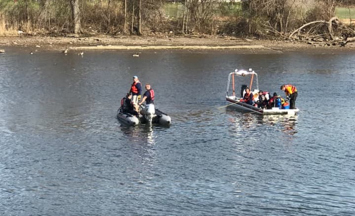 A car abandoned near the riverbank prompted the water search.