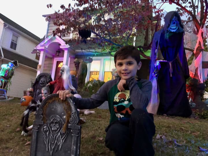 Brody, 9, creates what might be the most haunted Halloween display in Westwood every year in his front lawn.