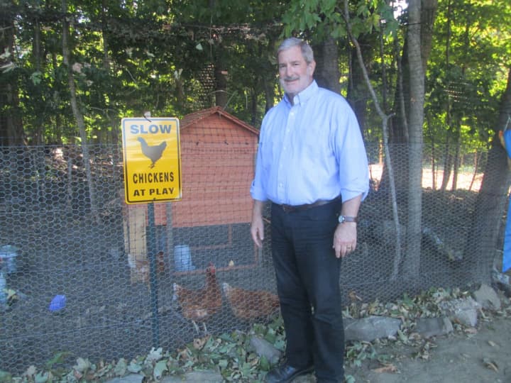 Rabbi Steven Kane stands in front of CSI&#x27;s new chicken farm.