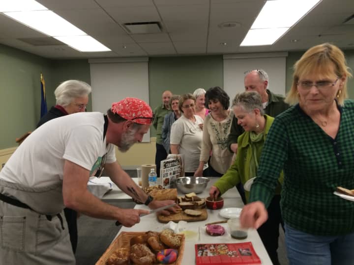 Chef&#x27;s Table fans sample some of Richard Herzfeld&#x27;s fresh breads, bagels and cookies at Fairfield Public Library.