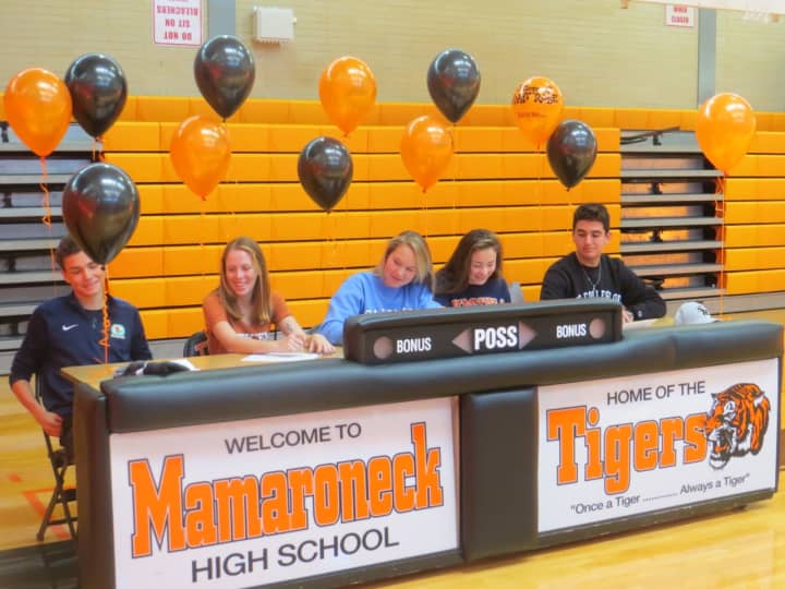 Mamaroneck High School student-athletes signing their letters of intent during a ceremony Wednesday are, from left to right, Samuel Morton,  Lindsay Devore, Nina Smoor, Alexa Cestaro and Andrew Francella.