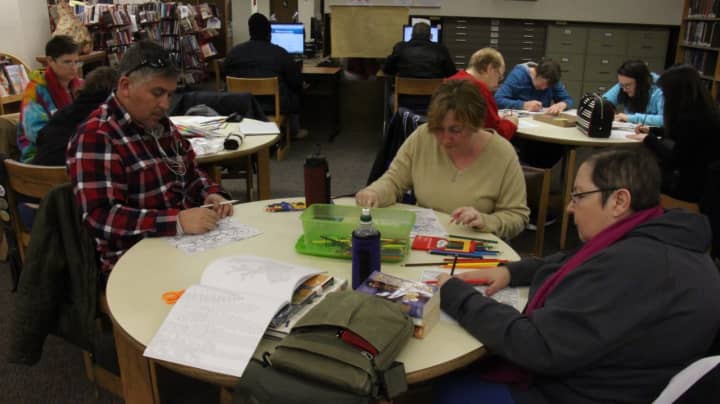 Various ages show up for Adult Coloring at Lodi Memorial Library .