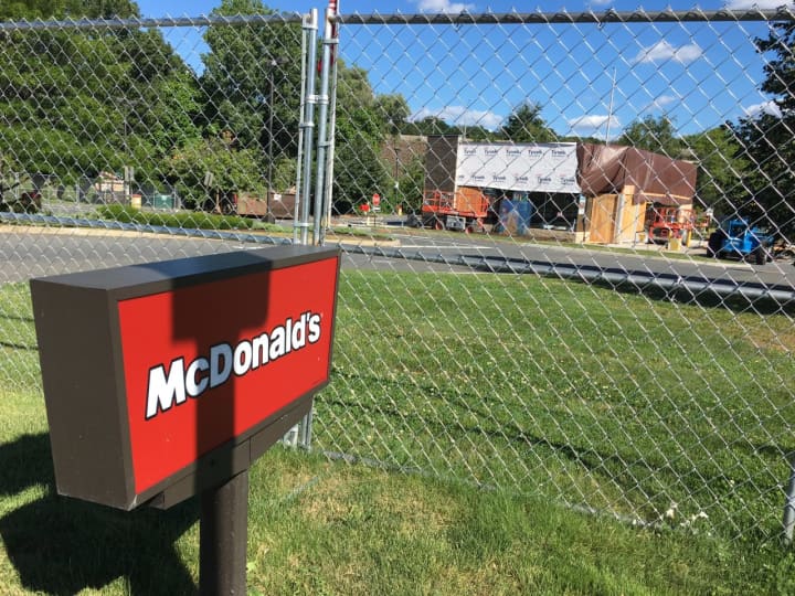 The McDonald&#x27;s on Lake Avenue Extension in Danbury is closed for renovations. A large fence surrounds the entire property.