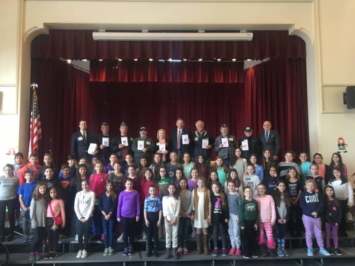 Assemblyman David Buchwald, local veterans and students during the Valentines for Veterans assembly at S.J. Preston Elementary School in West Harrison on Feb 10.