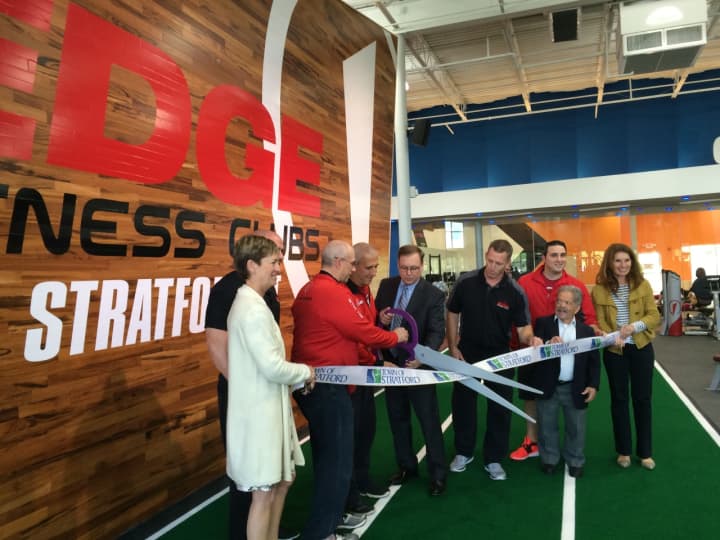 Local dignitaries help Fitness Edge staffer celebrate their new location in Stratford.