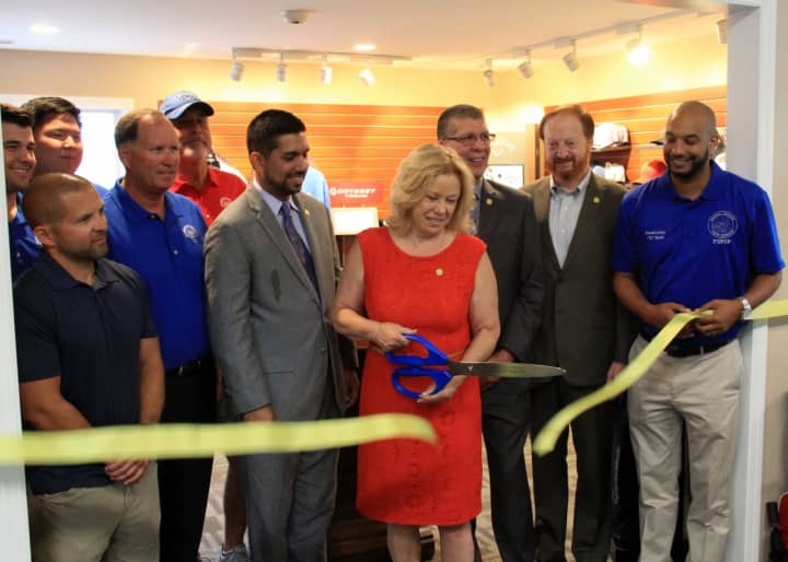 Passaic County Freeholder Director Cassandra Lazzara cuts the ribbon on the new golf shop at Preakness Valley Golf Course in Wayne.