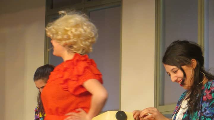 Is that Dolly Parton? Close. It&#x27;s Elizabeth Montemurro playing Doralee Rhodes in &quot;9 to 5!&quot; at Port Chester High School. Ryan Heffernan (seated) plays the unlikeable boss, &quot;Mr. Hart,&quot; also known as Franklin Hart Jr.