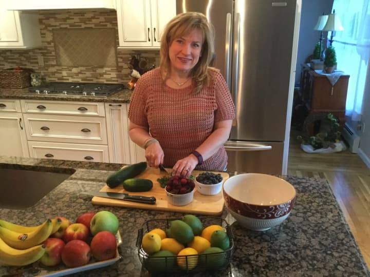 Jo Ann DiGiacomo prepares a healthy meal in her Montvale kitchen.