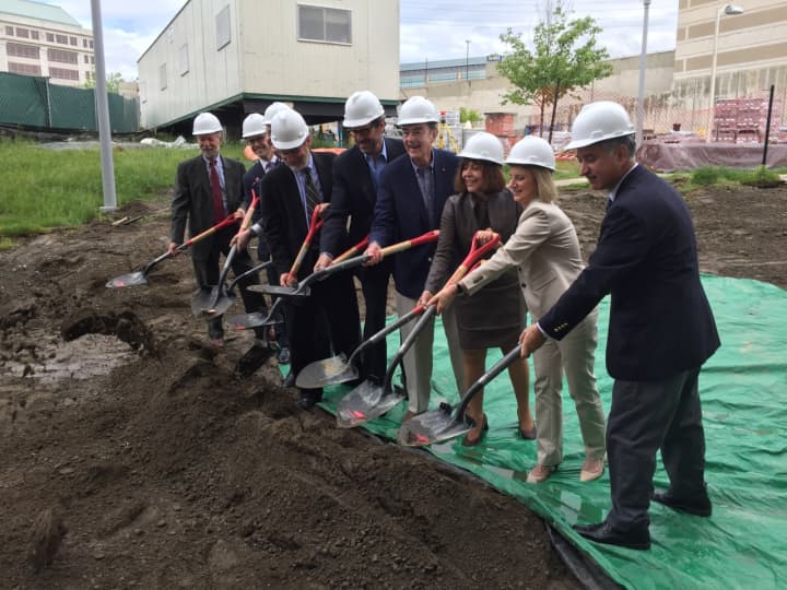 Officials held a groundbreaking ceremony Tuesday for Metro Green III, a new high-rise apartment building under construction near the train station in Stamford.