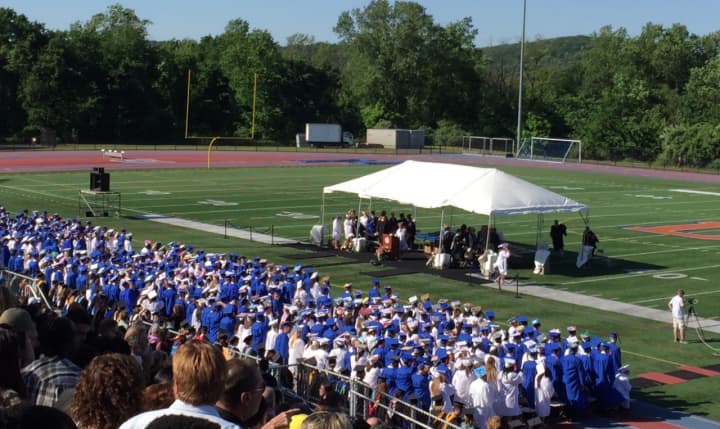 The Class of 2016 at Danbury High School takes the field Thursday night for graduation under clear blue skies.