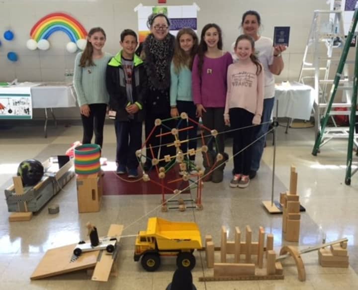 The Briarcliff Middle School &quot;Toy Squad&quot; stands behind their award winning Rube Goldberg machine.
