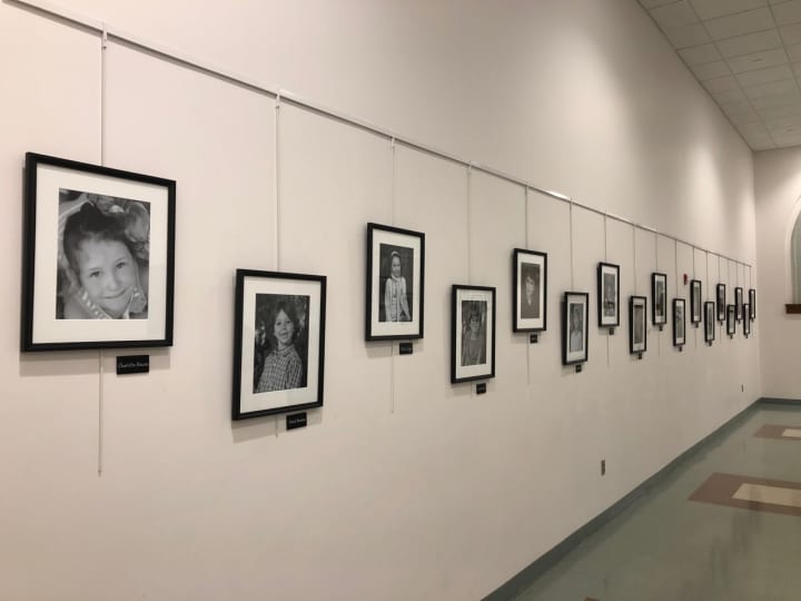 The Wall Of Remembrance in the Newtown Municipal Center includes black-and-white photos of the 26 victims of the Sandy Hook School shooting.