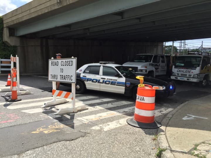 A Stamford police cruiser blocks off the southbound side of Atlantic Street Wednesday due to construction.