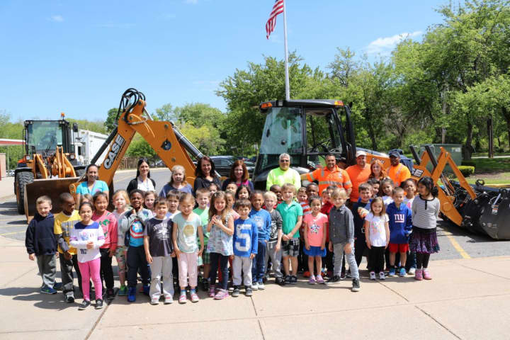 Ward Elementary School students visit the Department of Public Works&#x27; big trucks.