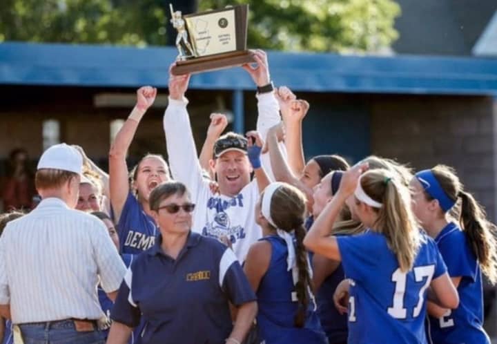 Keith Johnson celebrates a 2016 state title with the Northern Valley Demarest softball team.
