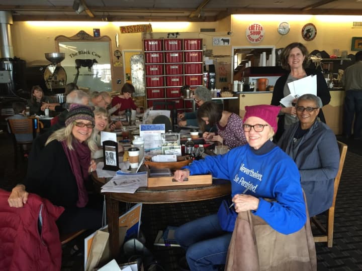 Soli Pierce, far left, with fellow postcard writing attendees at The Black Cow Coffee Company in Croton.