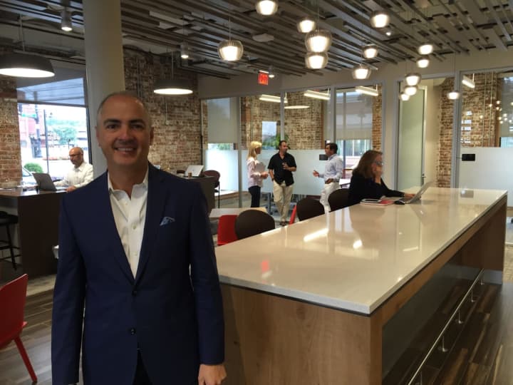 John Arenas, CEO and founder of Serendipity Labs, which has more than 100 co-working locations, stands in the company&#x27;s new Stamford location.