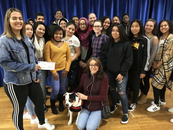 Hackensack High School journalism students from all grades raised more than $800 for Pawsitively Forever. Seated is Laura Witzal with rescue pup Allie.