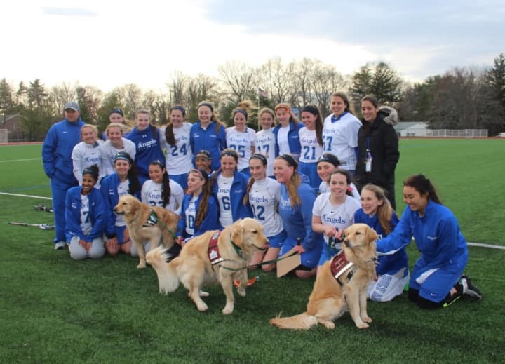 Holy Angels Lacrosse and service dogs from Mickey&#x27;s Kids.