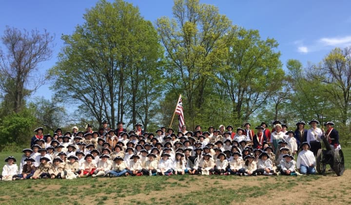 Students decked out in period costumes.