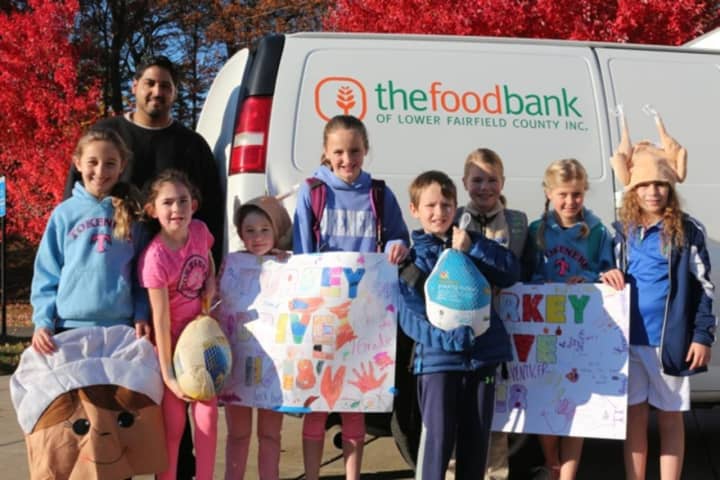 The annual Kids Care Club Turkey Drive at Tokeneke Elementary School recently collected 140 frozen turkeys, hams and chickens for the Food Bank of Lower Fairfield County.