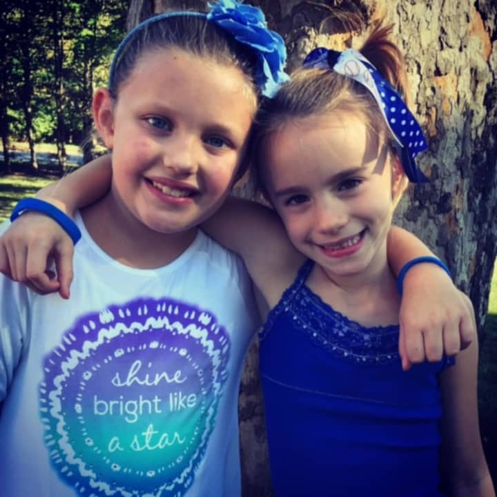 Best friends Ellorie Roberts of Washington Elementary School and Gina Castronova of Jessie F. George Elementary School bought the blue bracelets with their own money.