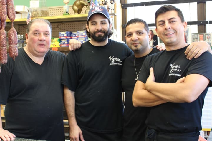 Adel “Andy” Hanna, second from right, and company at Visentini Brothers Deli 
