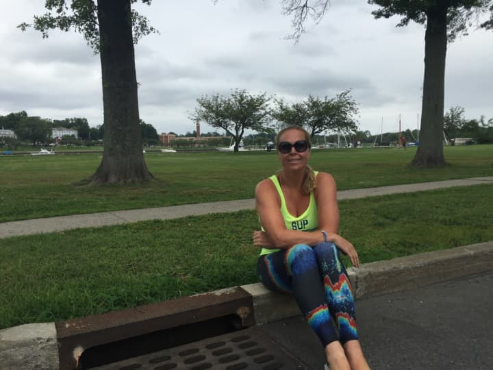 Nancy Vincent poses by a Mamaroneck drain.