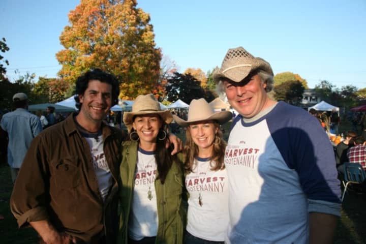 Karyn Leito (second from left) and Michelle Margo, organizers of the Black Rock Farmers Market, enjoy a sunny day with their husbands John Leito (left) and Robert Lendrim.