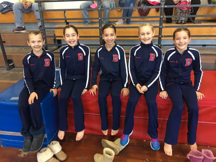 Darien YMCA Level 4 gymnasts Ava Licata, Anna Altier, Tanner Generoso, Lindy Mueller and Sophie Root were all smiles before the competition at the New England Invitational.
