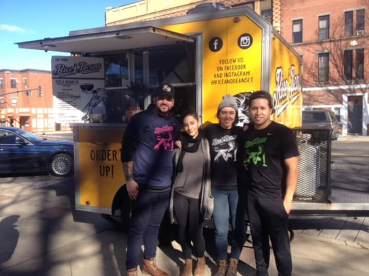 The crew of the Rice &amp; Beans food trailer step outside before serving lunch as part of a fundraiser Tuesday in Danbury. From left, Timothy Medina, Jihan, Sara Oberhammer and Jasson Arias.