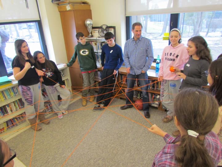 Irvington Middle School staff members and students participated in small group activities designed to promote the yearlong theme of building connections.