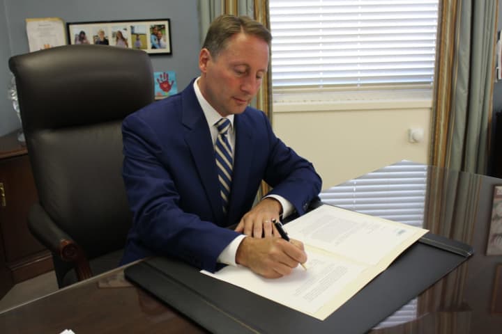 Rob Astorino vetoing the Immigrant Protection Act. The override attempt fell one vote short.