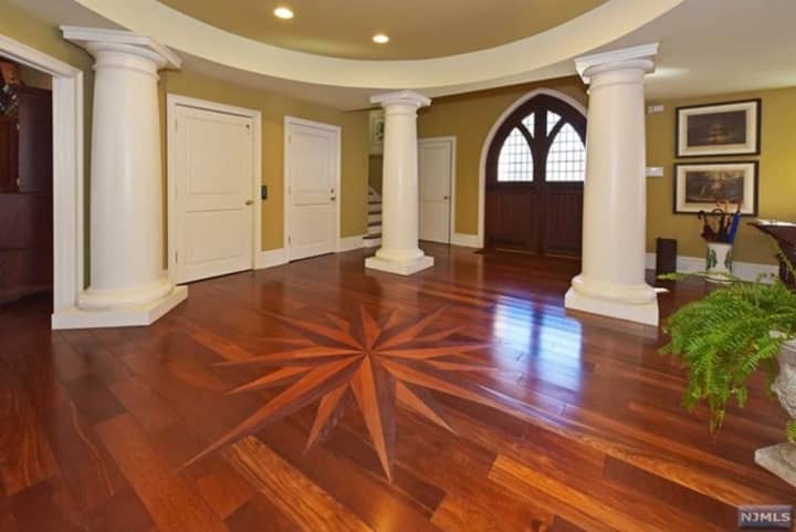 This historic home is listed as the most expensive in Upper Saddle River and features exquisite woodwork  from around the world.
