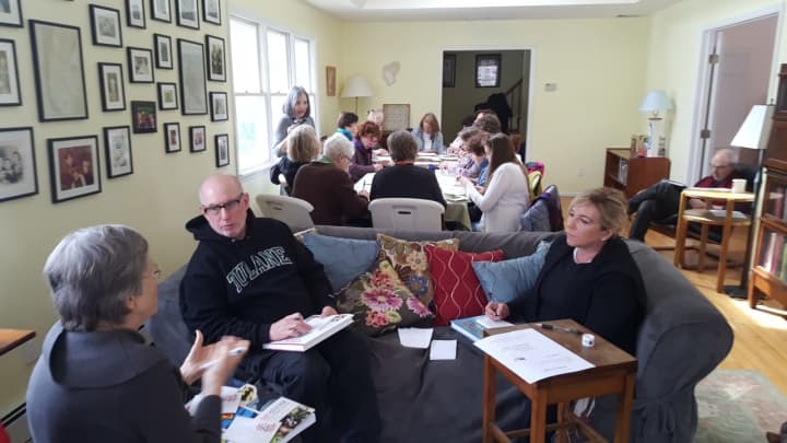 Members of CD17Indivisible and others participate Sunday in the &quot;Ides of Trump&quot; campaign. The goal of the national campaign is to send the White House at least a million postcards expressing concerns about current policies on Wednesday, March 15.