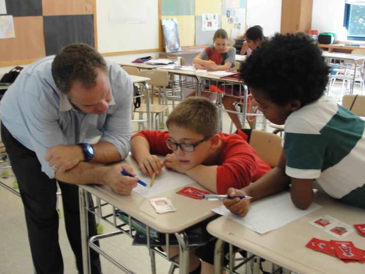 Seventh-graders in Gregg Pernick’s math class turn the classroom into a battlefield when they played Integer War, a fun and interactive card game, as part of their studies. 