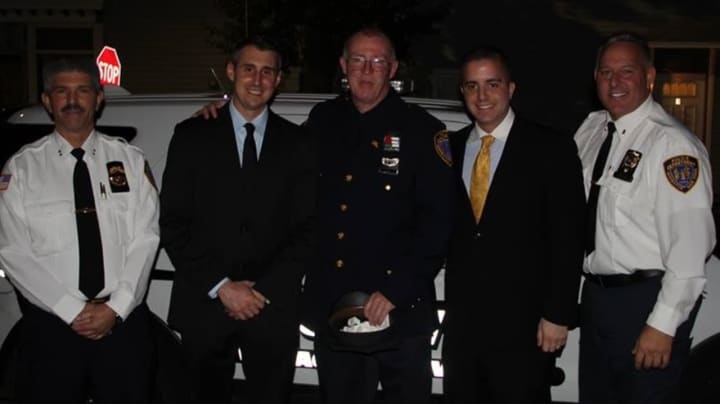 Irvington Police recently congratulated Sgt. Edmund Vize, center, for his promotion and welcomed officers Paul Robibero, second from left, and Angelo Liberatore, second from right. At left, is Chief Michael Cerone; at right, is Lt. Michael Morano.