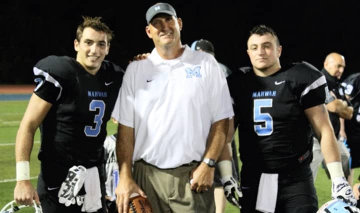 Mahwah High School Varsity Football Coach Jeff Remo with Quarterback James Ciliento, left, and Runningback Mike Peltekian.