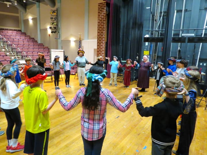 Sixth-graders at John Jay Middle School participate in medieval dancing.