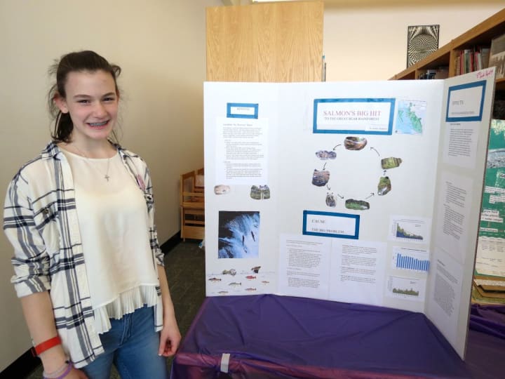 John Jay Middle School eighth-grade student Ashley Stagnari received an award for her project “Salmon’s Big Hit” at the school’s science fair.