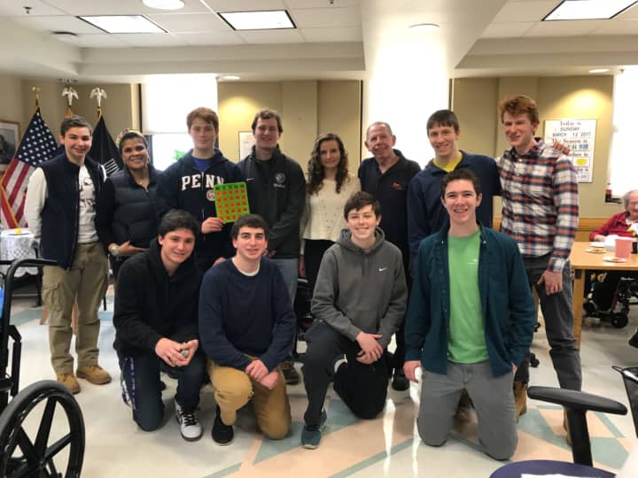 Members of John Jay High School&#x27;s JJ for Vets club pose for a photo with Kenneth C. Klotzkin, a retired Air Force colonel.