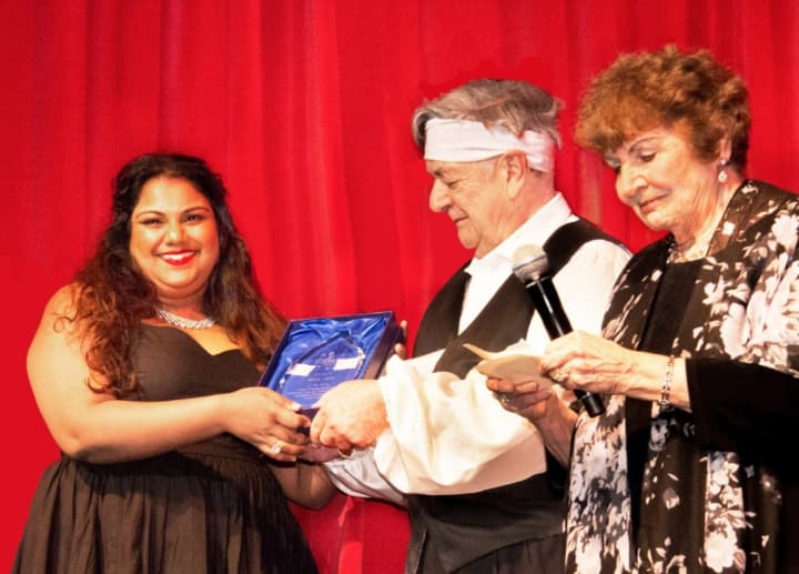 Third place winner (left) Janani Sridhar and first place winner, Sol Jin (far right), receive their awards in the New Jersey Association of Verismo Opera’s 27th Annual International Vocal Competition.